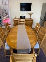 Solid Oak table and 6 matching chairs 