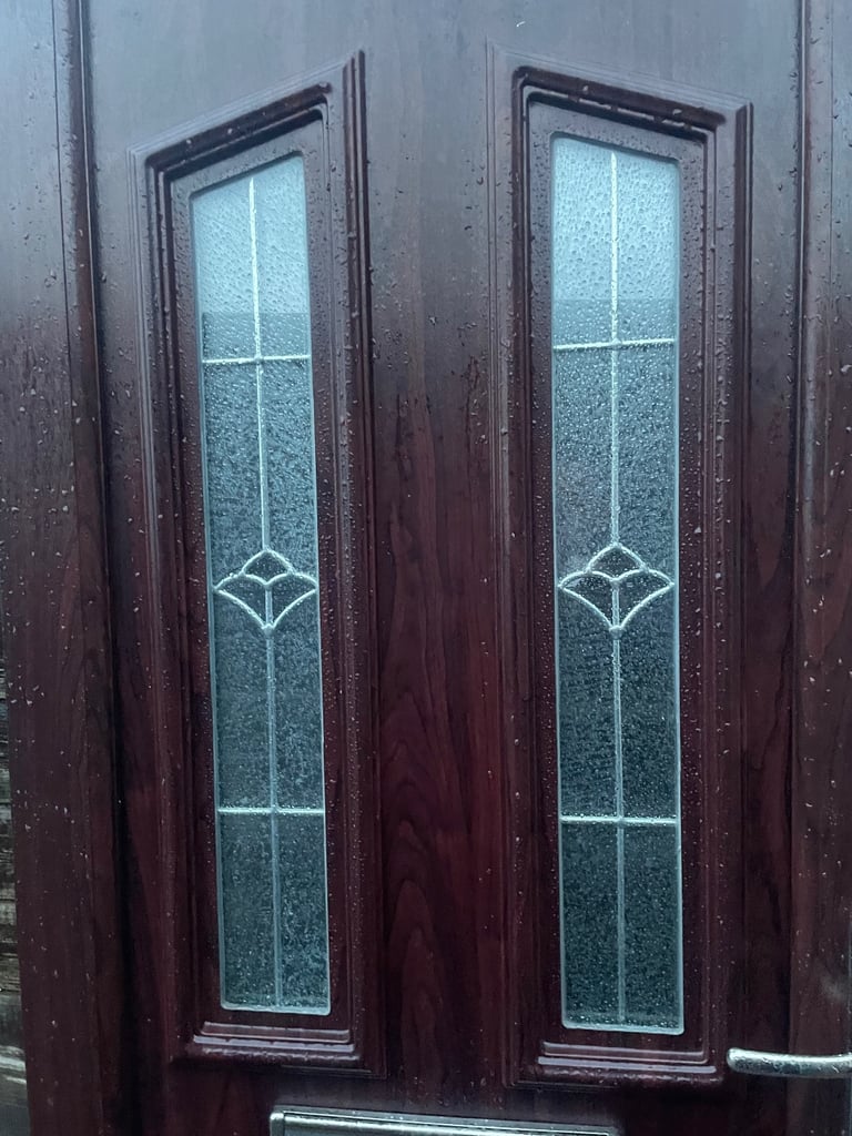 Upvc front door in rosewood 