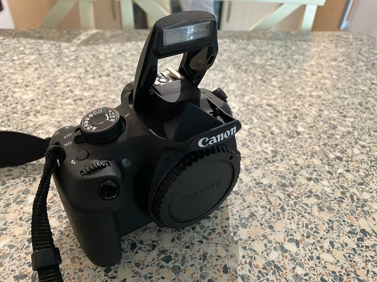 Canon DSLR Camera with Multiple Lenses and Equipment