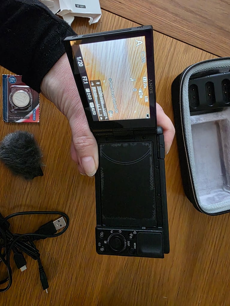 Sony ZV-1 vloggers camera with case, 4x batteries and  tripod camera grip