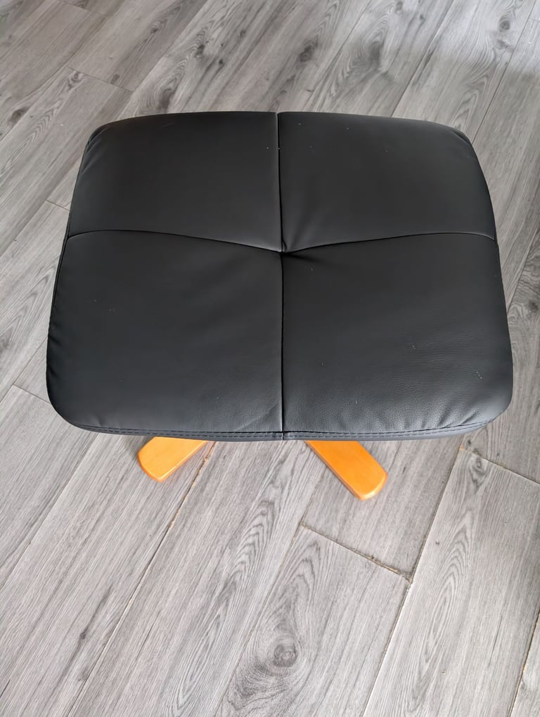 Black leather recliner chair with storage foot stool 