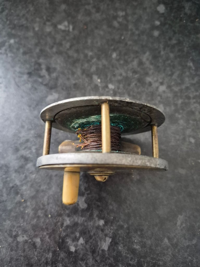 Brass era fishing reel 