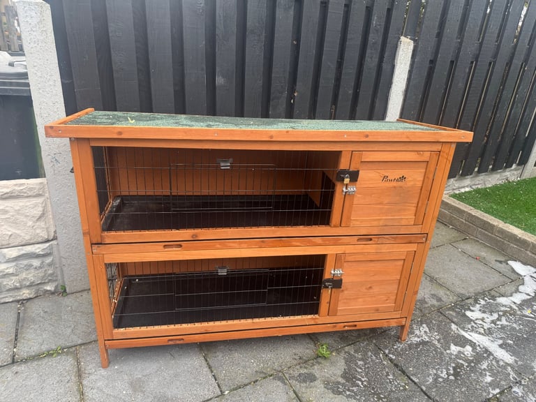 Animal hutch with sliding trays 