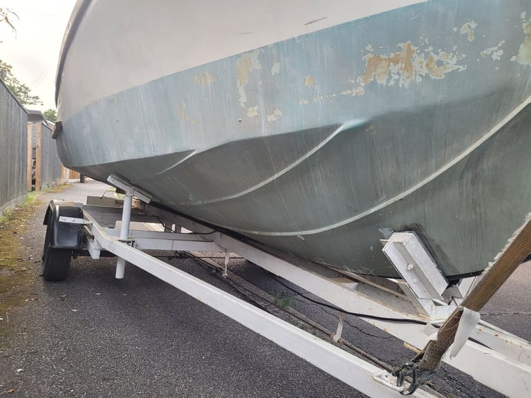 19ft cabin boat, inboard engine and road trailer