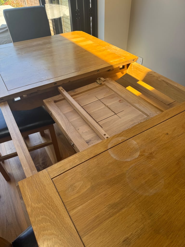 Oak Furnitureland solid oak extendable dining table, bench and 6 chairs
