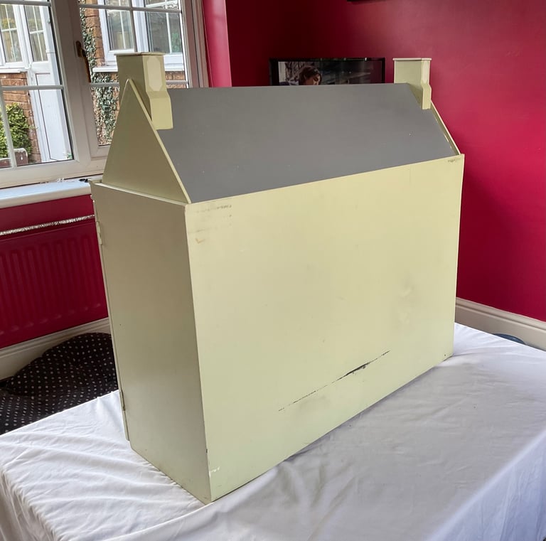 Handmade wooden dolls house with furniture and family