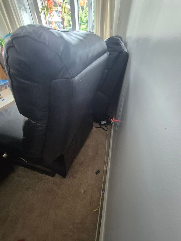 Two seater leather reclining sofa