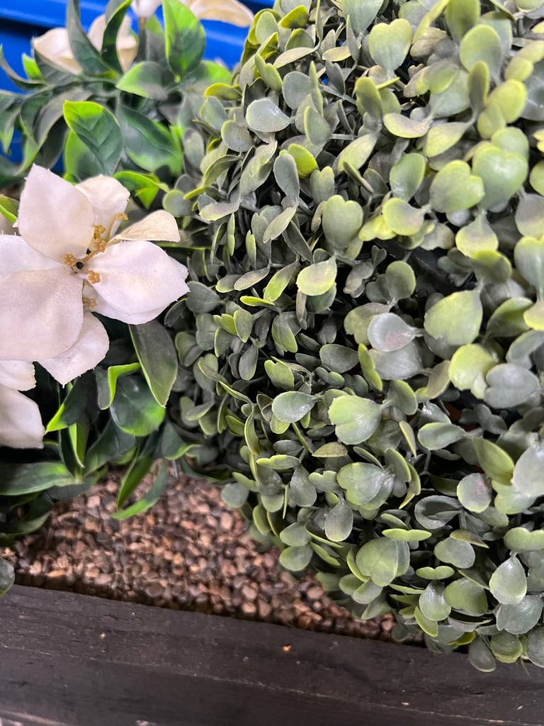 Fake plant in planter 