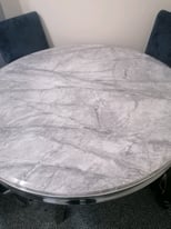 Louis round marble table with black velvet chairs
