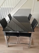 Black glass table and 4 chairs