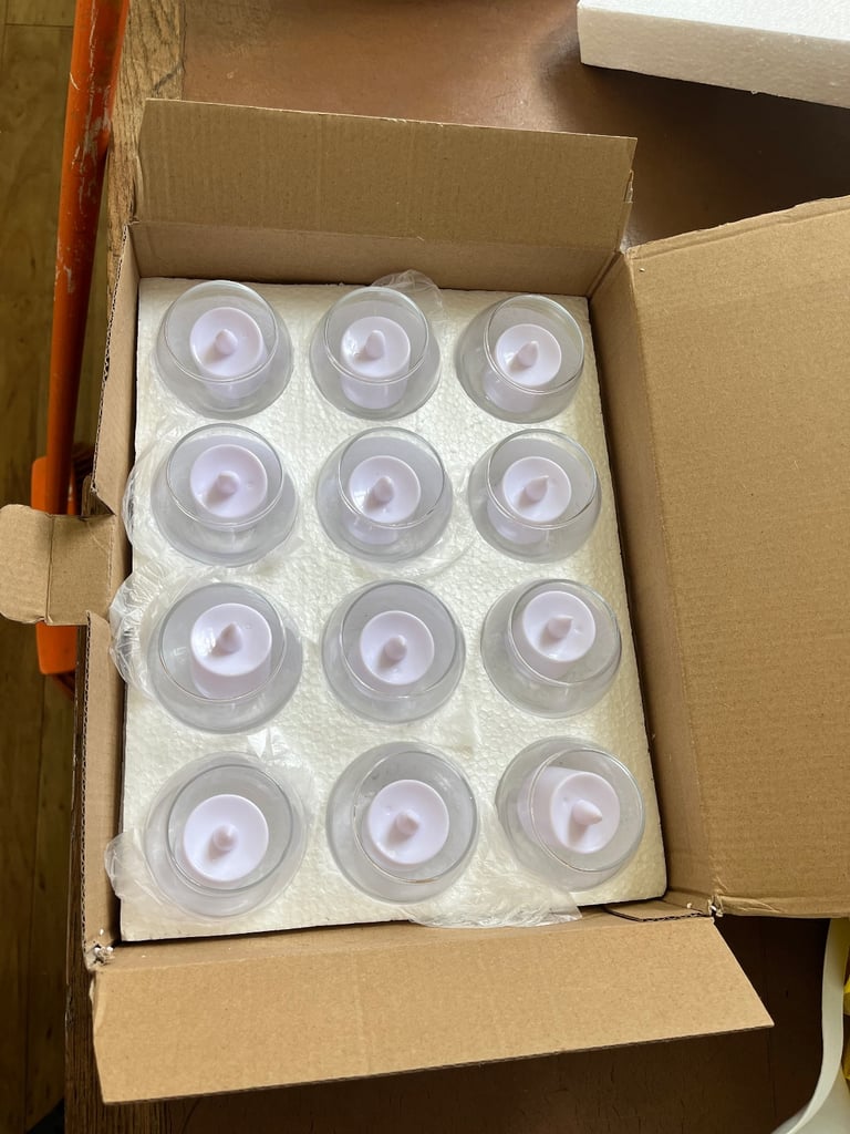 Small round glass candle holders with led blue lights 