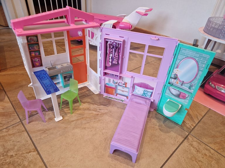 Barbie travel doll house