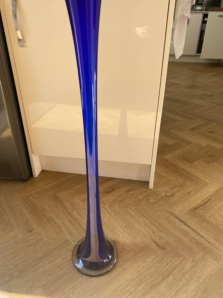 Blue glass tall vase. 