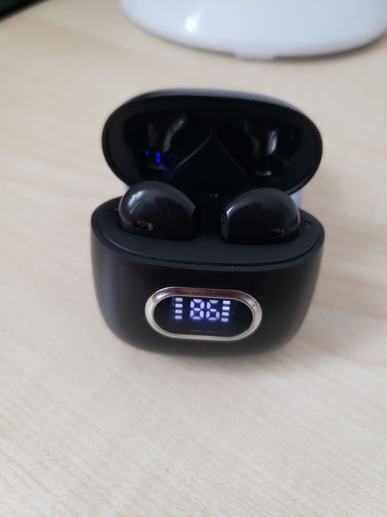 J52 Bluetooth earbuds with a digital display indicating the battery level.