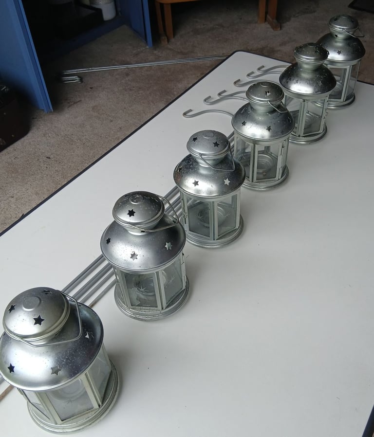 Six garden lanterns with six metal stakes