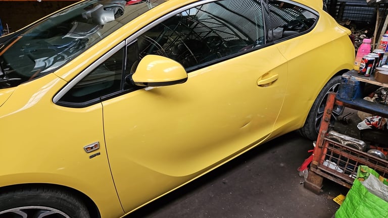 Vauxhall Astra GTC.  Passenger door mirror Yellow Breaking parts 