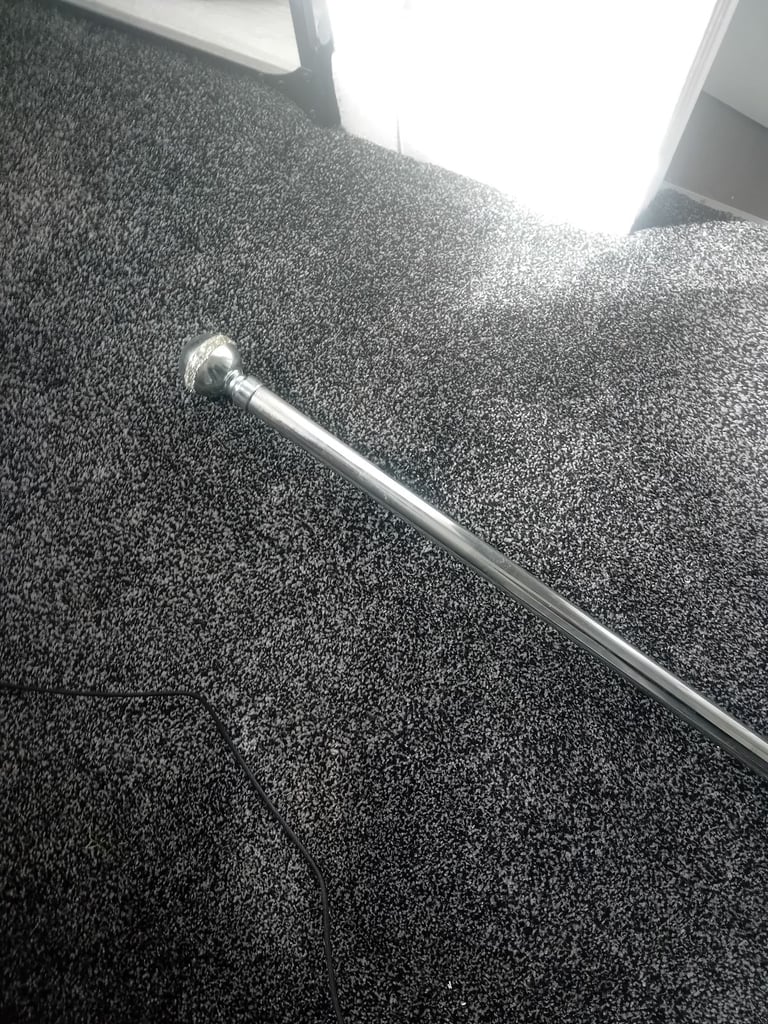 Silver extendable curtain pole