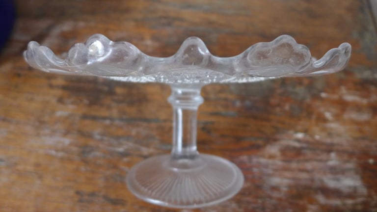 VINTAGE ANTIQUE GLASS CAKE STAND ON GLASS PEDESTAL.TASSA. SCALLOPED EDGE.