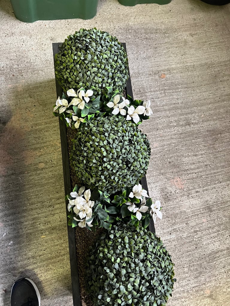 Fake plant in planter 