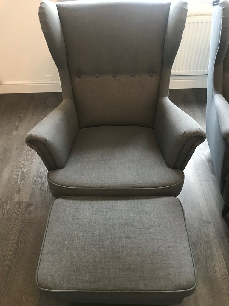 2 grey fabric high backed wing tipped chair with matching 2 grey fabric footstools, £140 for all 