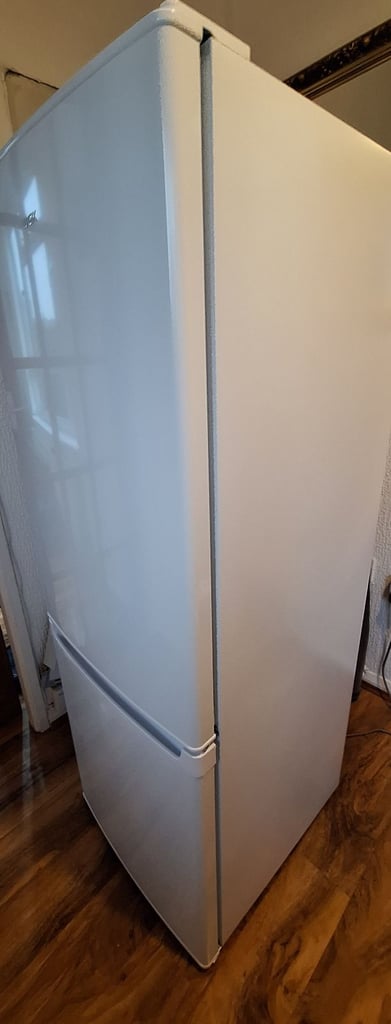 LOGIK fridge freezer size  H 142cm like new one year old 