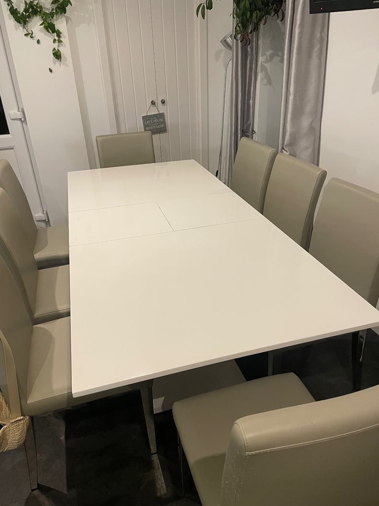 image for Extendable white and silver resin dining table and 8 chairs