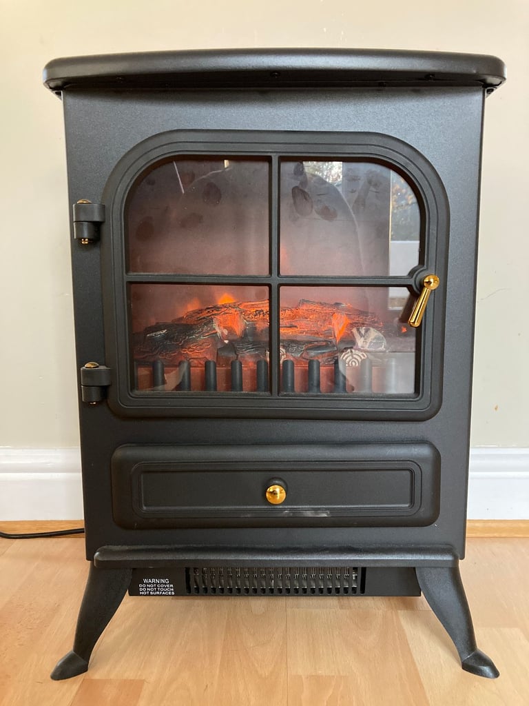 Electric log-effect heater with real-flame effect.  Boxed.  Hardly used.