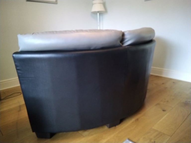 Black and grey leather corner unit.