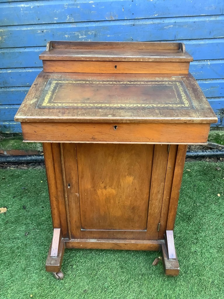 Victorian walnut brown leather insert davenport with ink wells & wheel castors