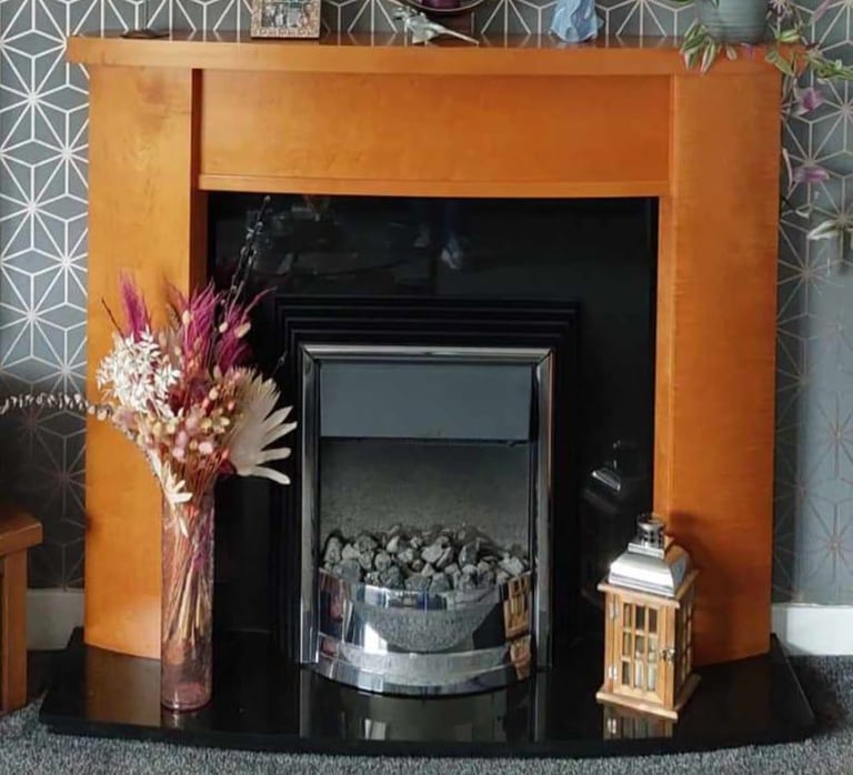 image for Wooden surround, blavk granite hearth and back panel and electice fire 