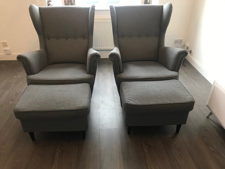 2 grey fabric high backed wing tipped chair with matching 2 grey fabric footstools, £140 for all 