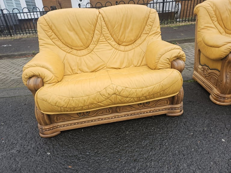 Leather sofa in soild oak inset with matching footstool 