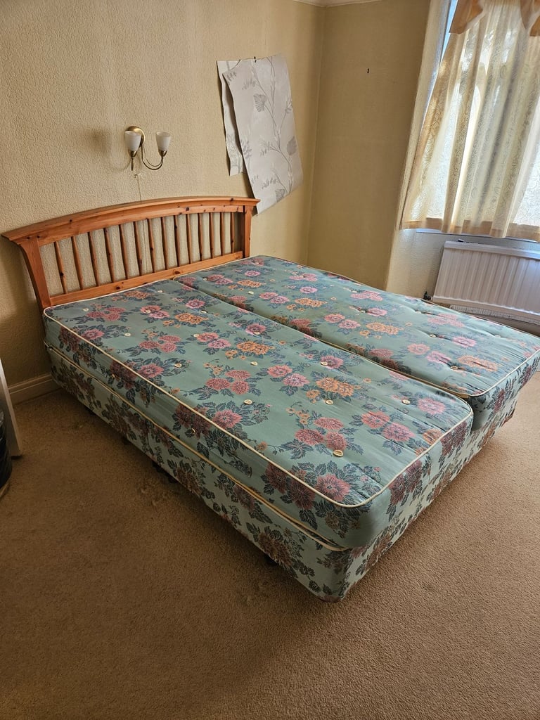 Kingsize bed with wooden headboard 