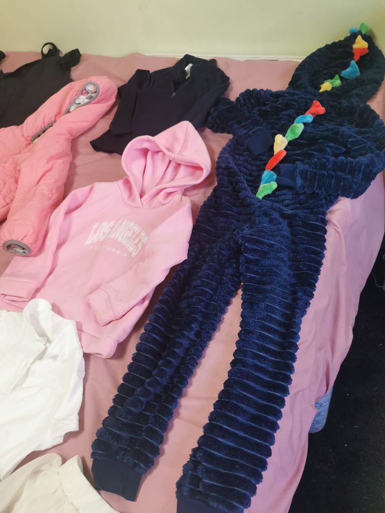 A set of clothes for a 5-6 year old girl. Most of the clothes are in good condition. 
