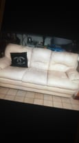 Leatherette cream sofa used condition has tear on top corner but don't effect use