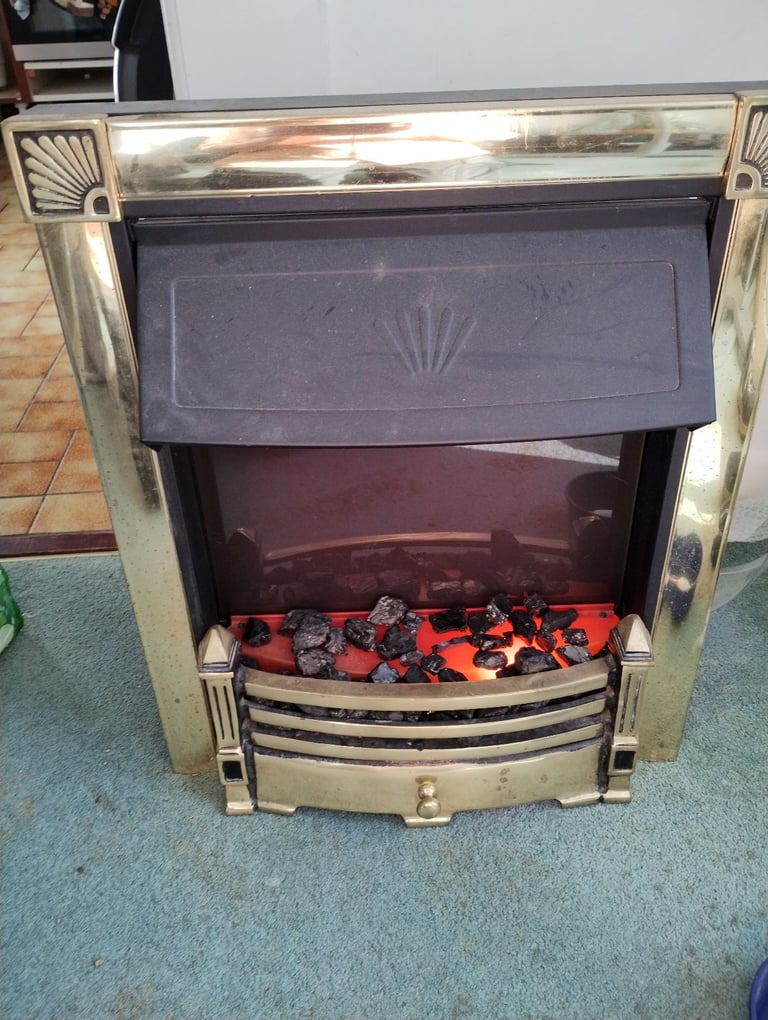 Coal effect brass fireplace 