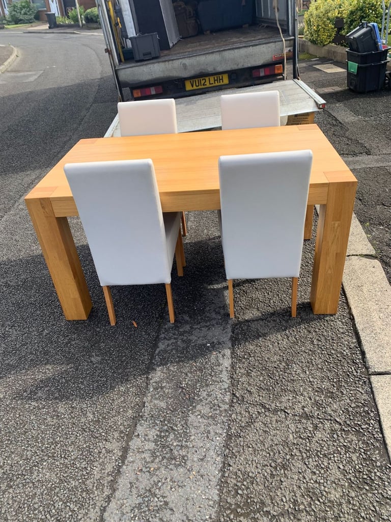 Soild oak table and 4 grey leather chairs 