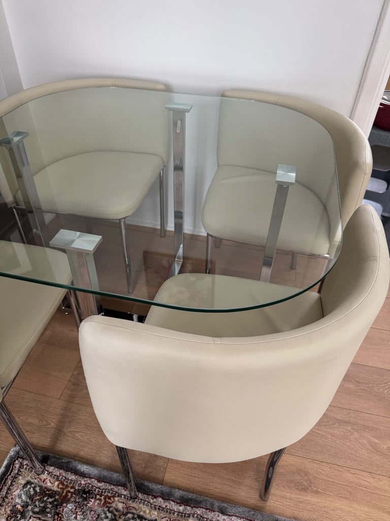 RRP £600 Stowaway dining table in cream finish with 4 chairs in excellent condition like new 