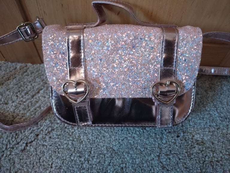 image for Claire's Accessories Pink Sparkly Heart Buckle Hand Bag
