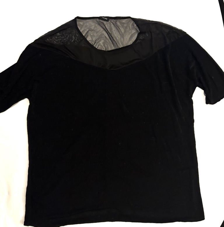 size 26/28 black top with glitter detail. By Yours
