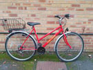 Challenge Performance Hybrid Bike in good condition with a new rear basket