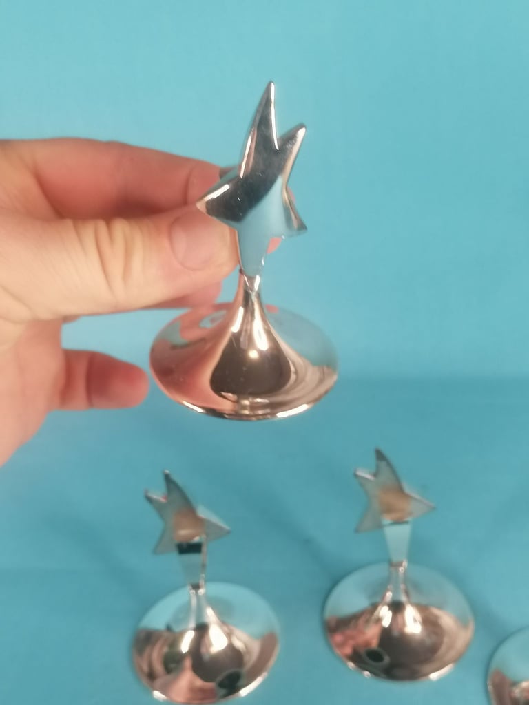 Stainless steel STAR PLACE CARD HOLDER. As seen.