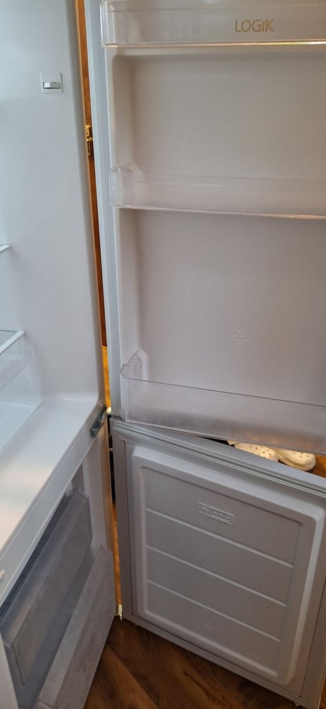 LOGIK fridge freezer size  H 142cm like new one year old 
