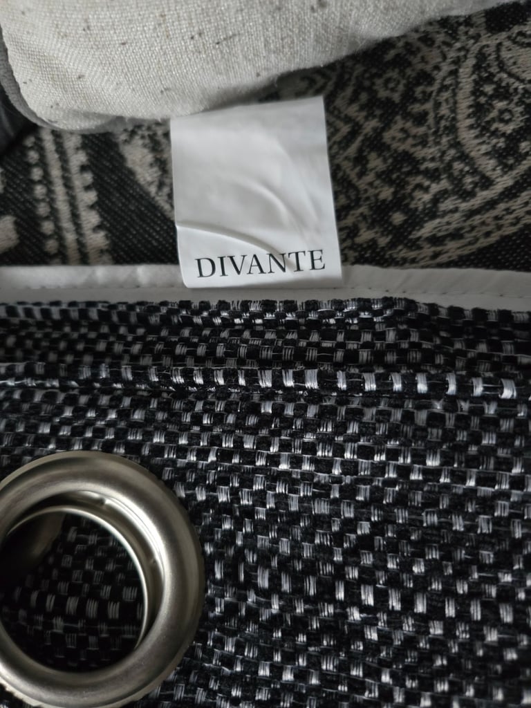 Halden Black Eyelet Lined Curtains