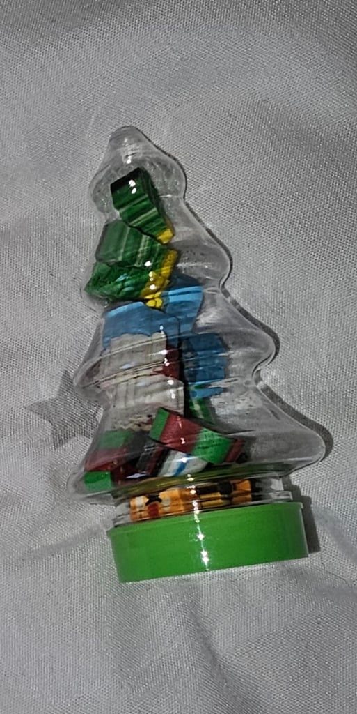 Mini novelty Christmas rubbers/erasers in a Christmas tree tub £2 each