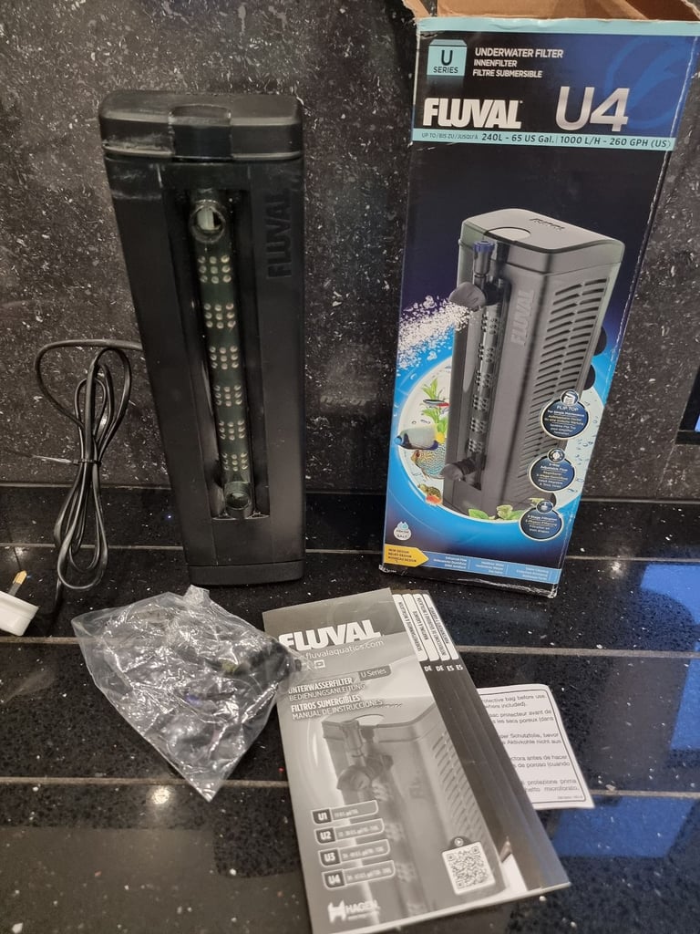 Fluval U4 underwater filter, thermometer and faux stone decoration