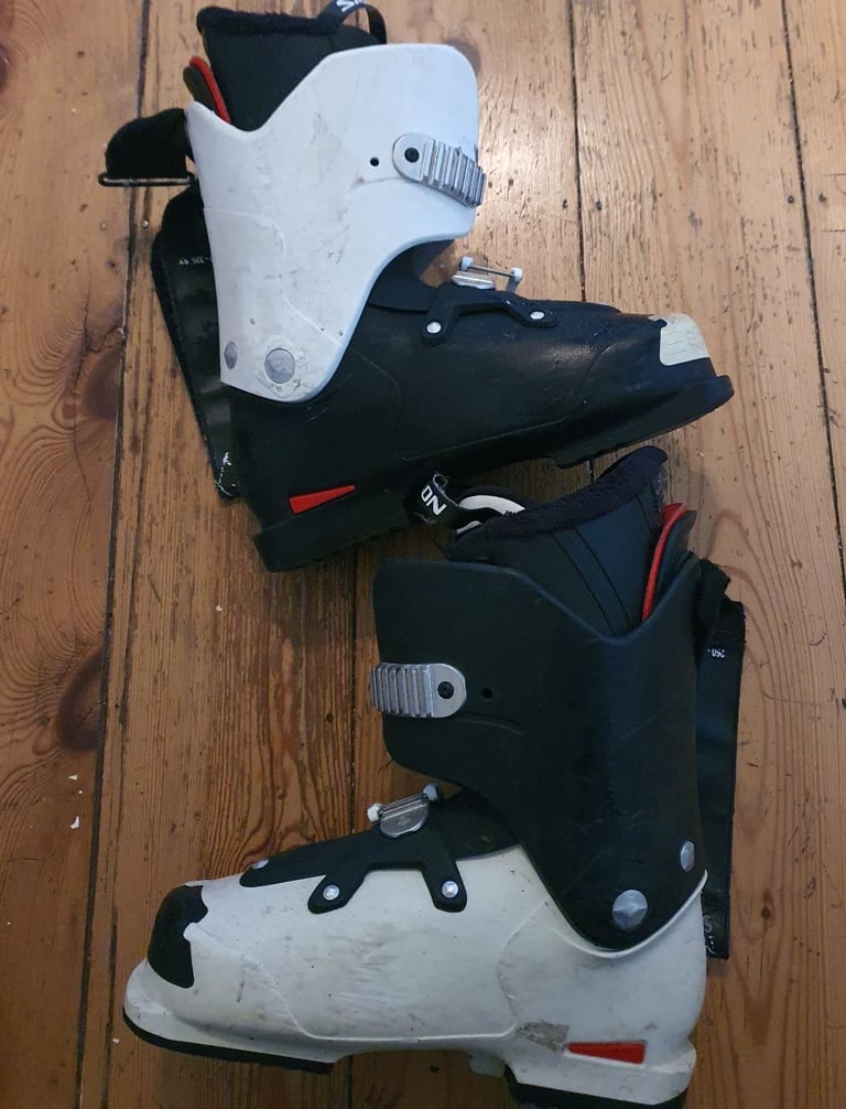 image for For sale are pair of ski boots and skis.