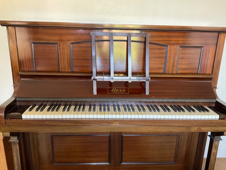 UPRIGHT OVERSTRUNG MAHOGANY PIANO WITH JOHN AUSTIN STOOL