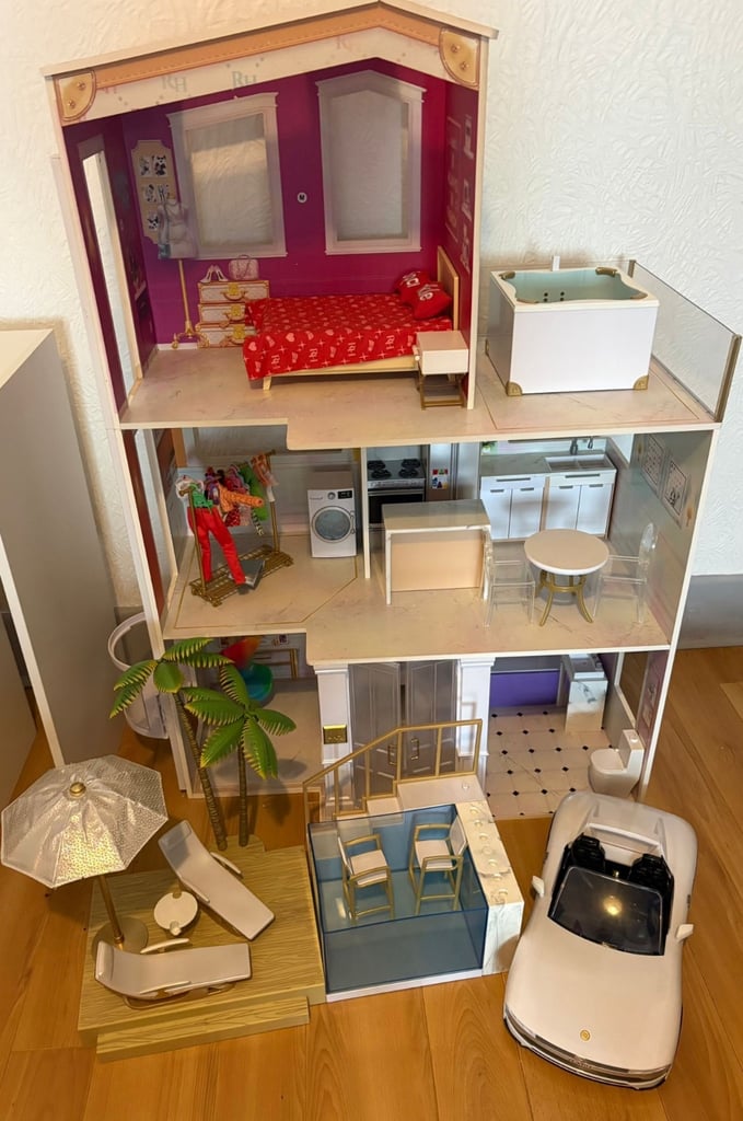 Large Rainbow high dolls house with light up beach pool and car.   