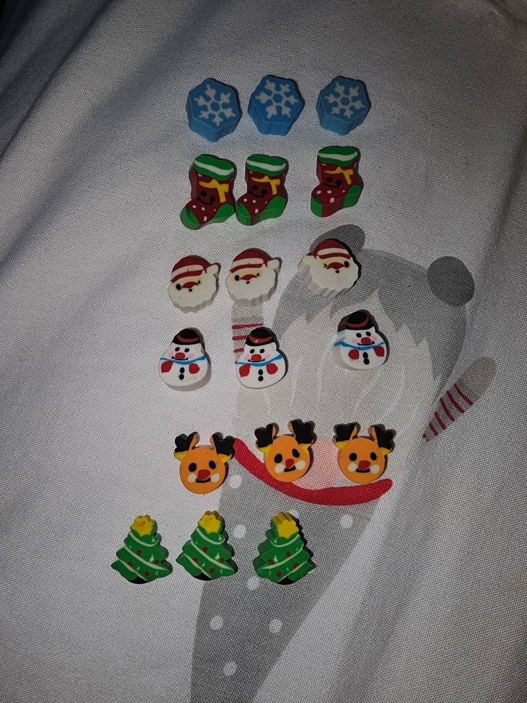 Mini novelty Christmas rubbers/erasers in a Christmas tree tub £2 each